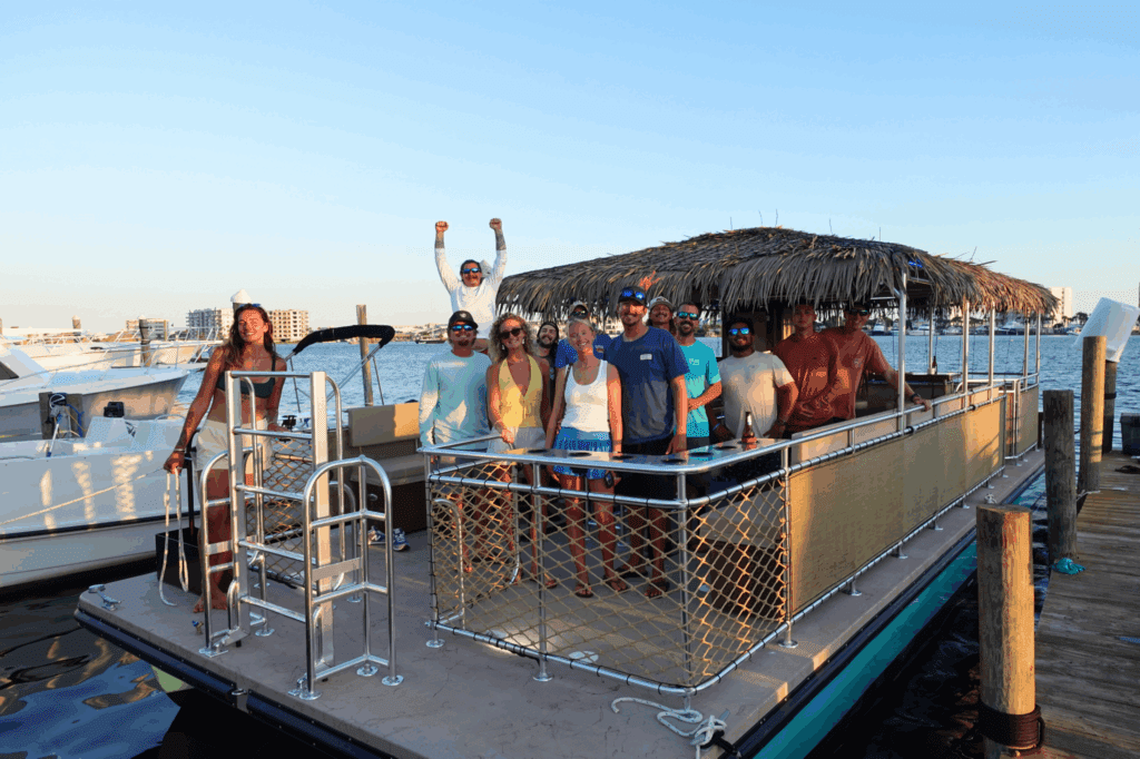 a group of people on the tipsy tiki boat
